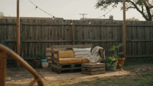 A cozy backyard oasis on a budget with repurposed furniture and string lights.