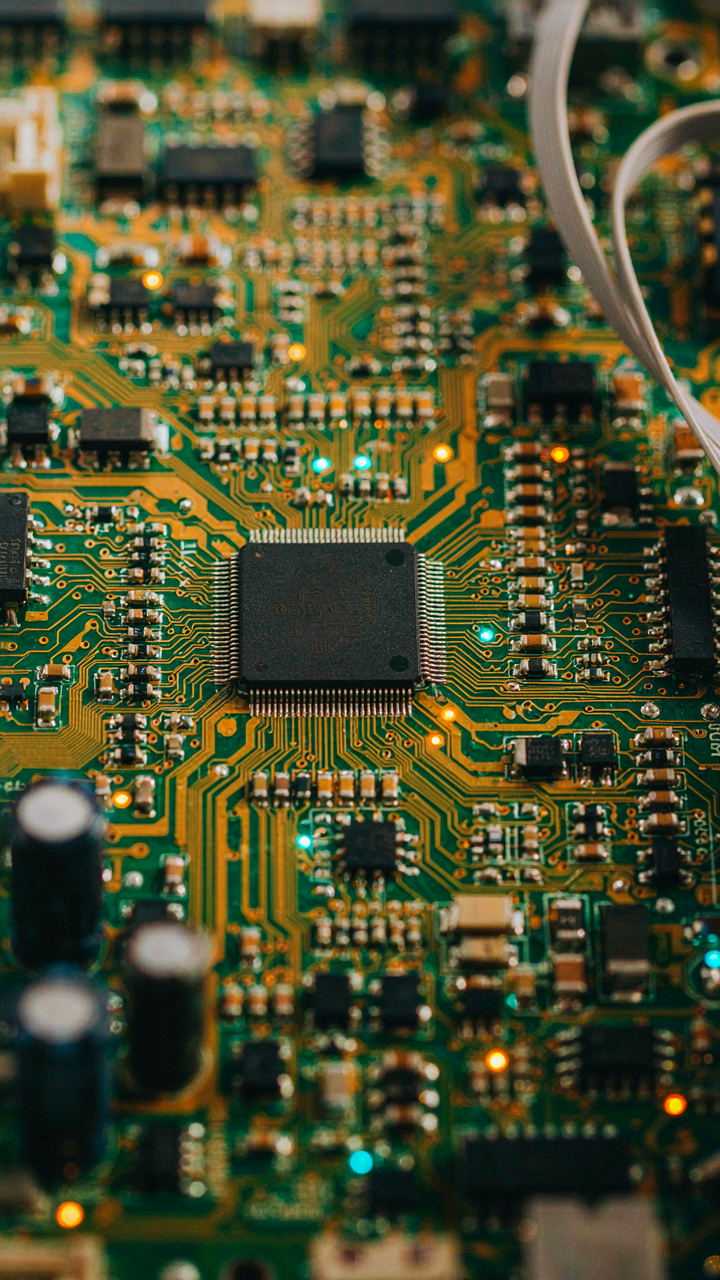 A close up view of a glowing, intricate circuit board.