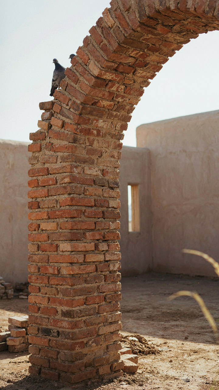 A strong and well-built brick archway stands as a structural element.