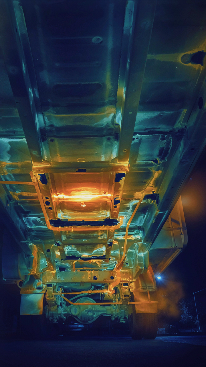 A thermal camera view shows cold spots on an RV's underbelly.