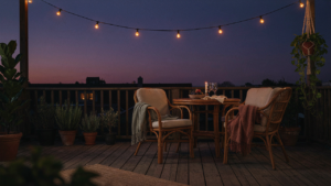 A warm and inviting cozy deck at dusk with soft lighting and comfortable furniture.