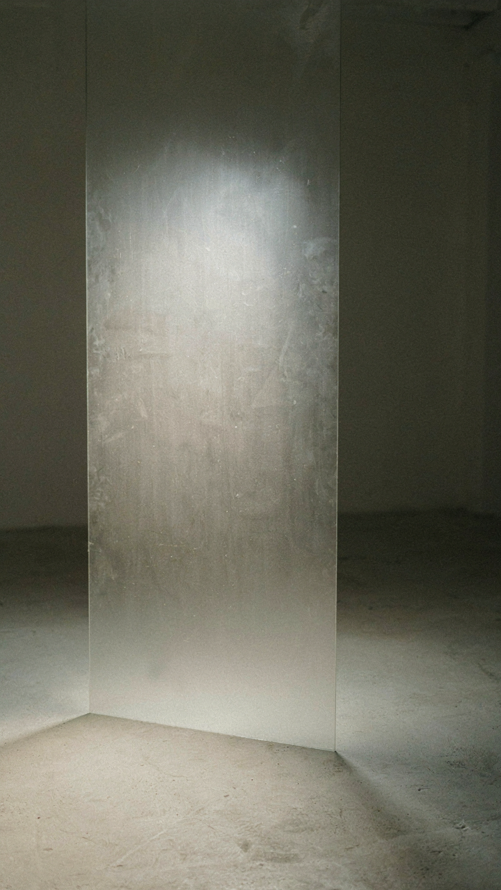 A frosted glass panel softly diffuses light into an even glow.
