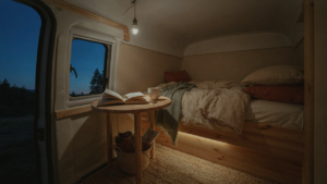 A warm, inviting camper interior with soft lighting at dusk.