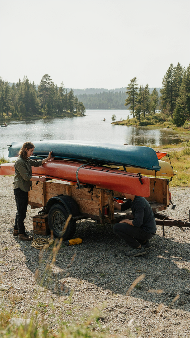 A couple uses a simple, functional DIY camper trailer to haul kayaks.