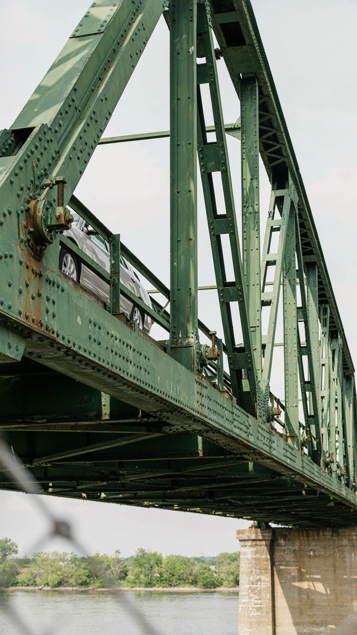 A bridge's structural supports show many beams and connections.