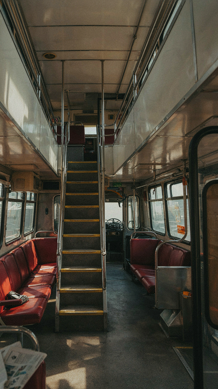 A double-decker bus interior has many small, fragmented spaces.