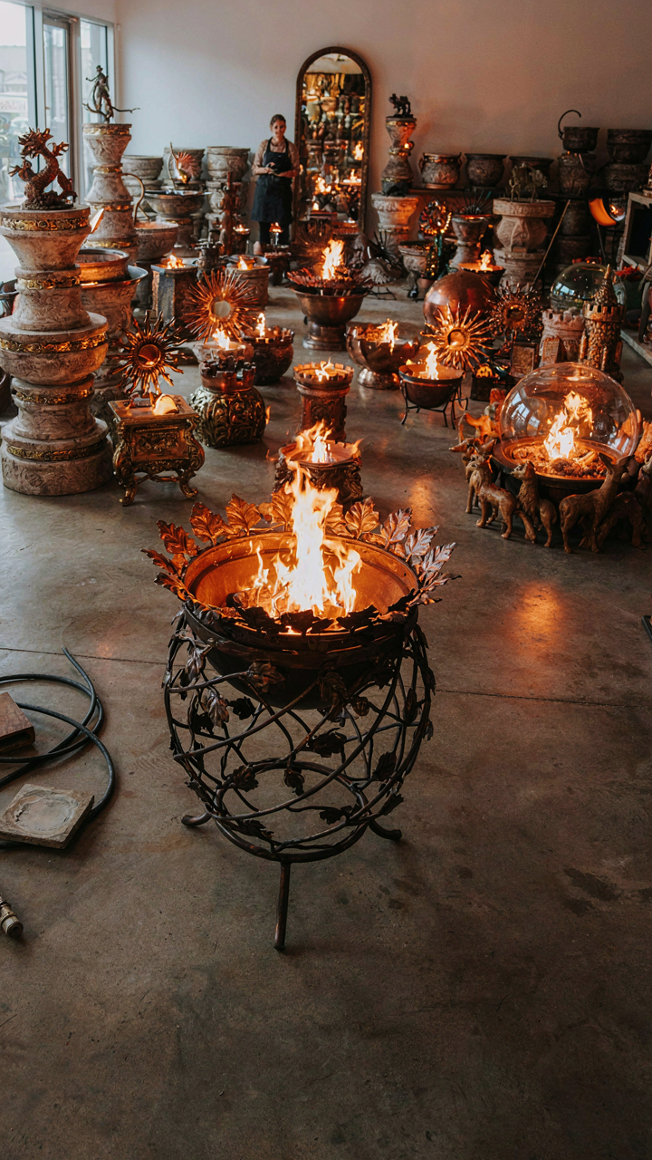 A showroom is full of many complex fire pit designs.