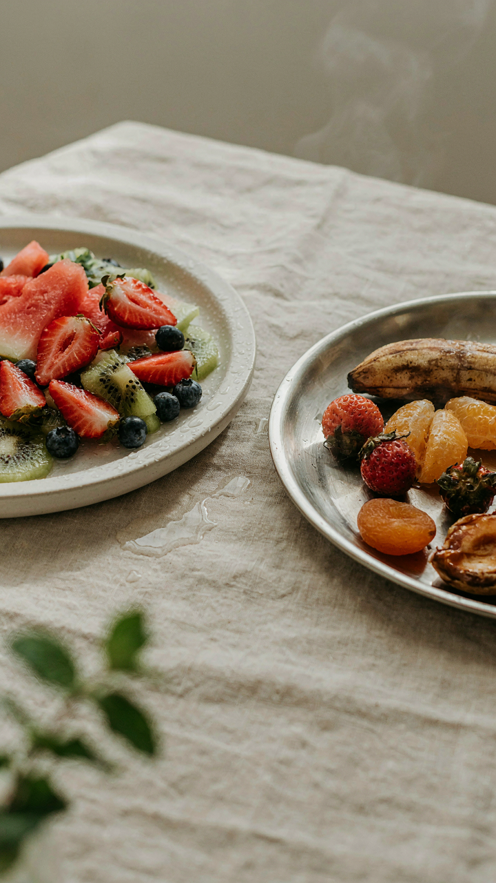 A chilled ceramic platter holds cold fruit, next to a warm metal platter with wilted fruit.