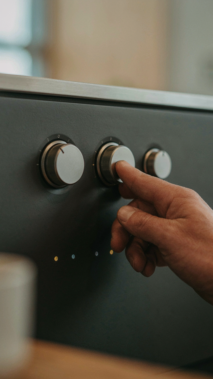 A lighting control panel with many switches and dials.