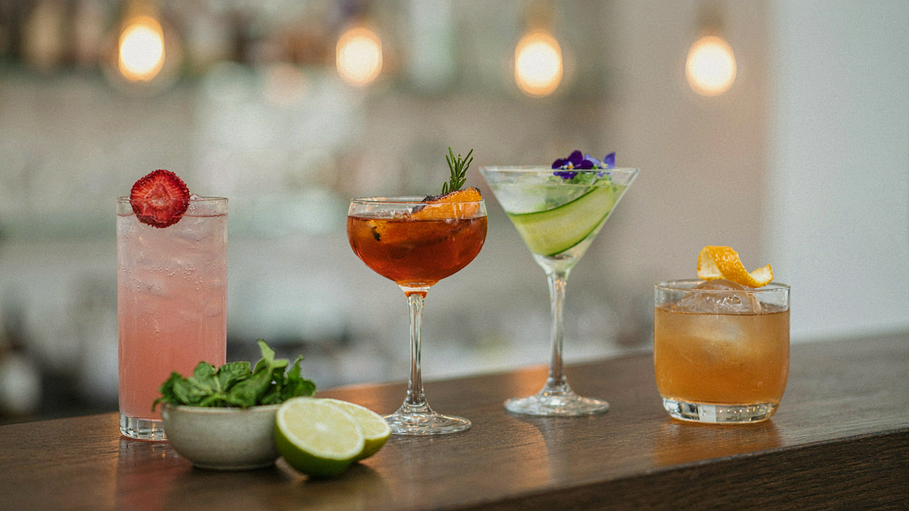 A collection of mocktails, each with unique and sophisticated mocktail garnish ideas.
