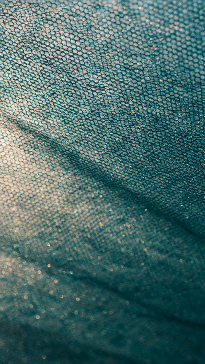 Close-up of a high-tech fabric designed for outdoor dining shade.