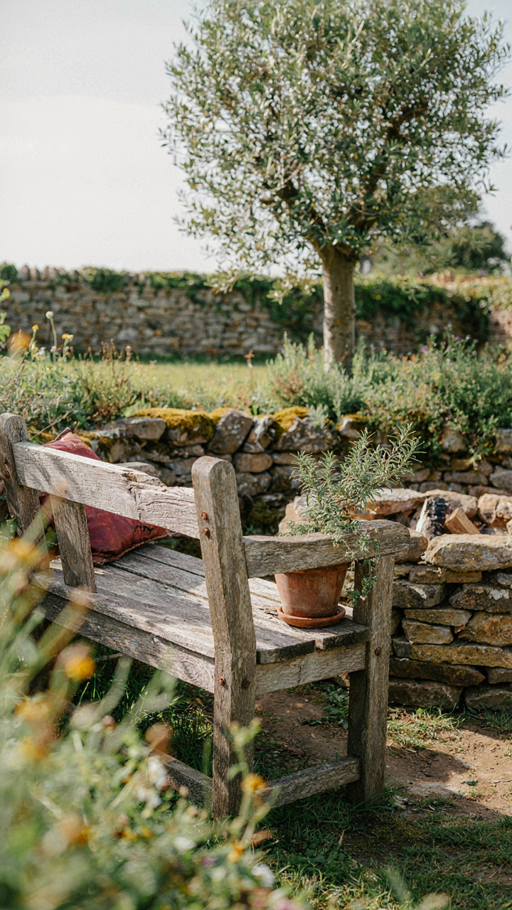 A rustic outdoor seating area made from weathered wood and natural stone.