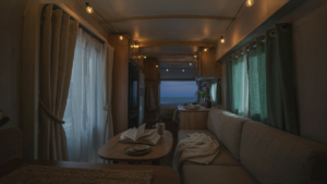 An RV interior at dusk with diverse rv curtain ideas on windows.