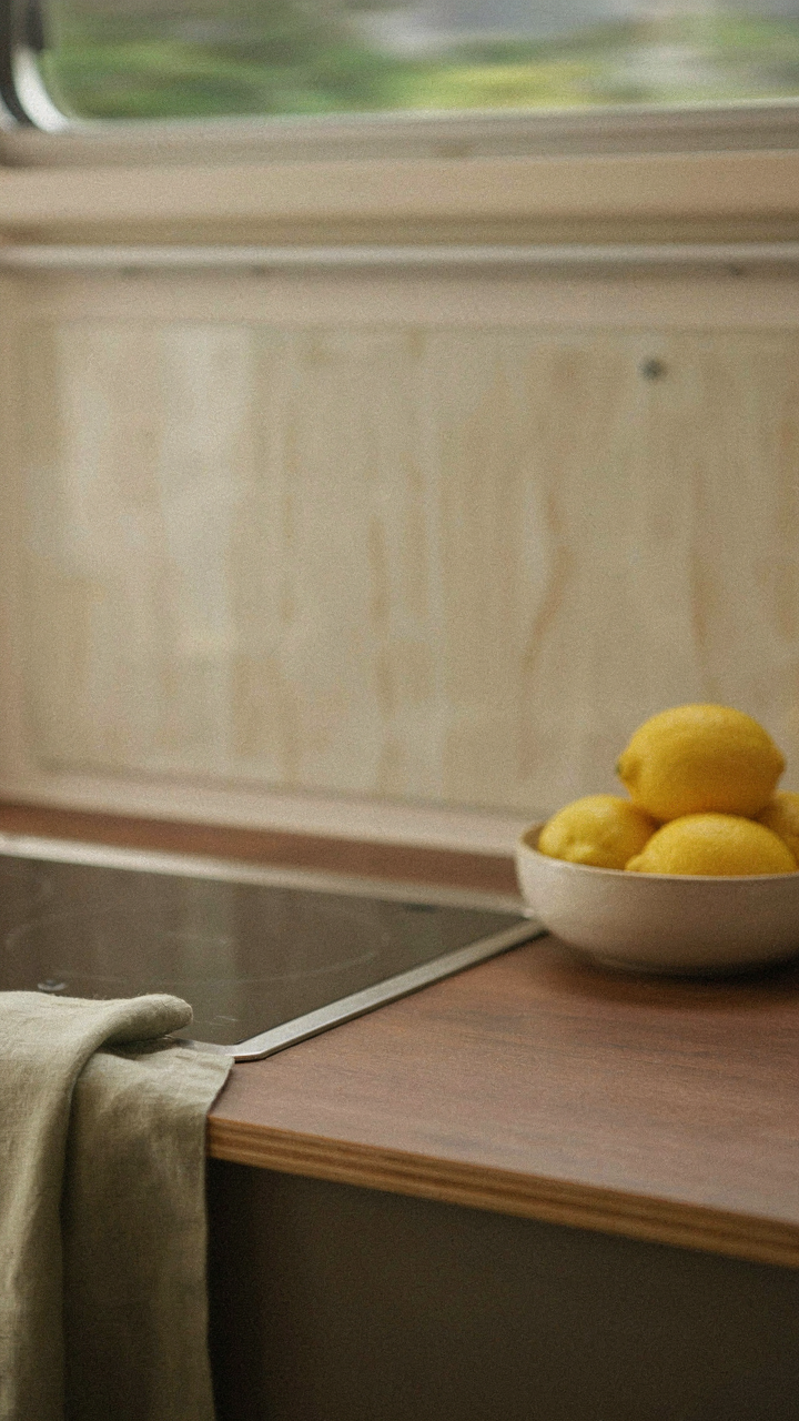 A beautiful RV kitchen with peel and stick counters and backsplash shows subtle movement.