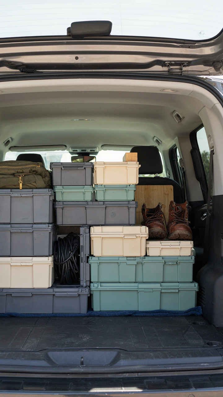 A perfectly organized storage compartment inside a minivan.