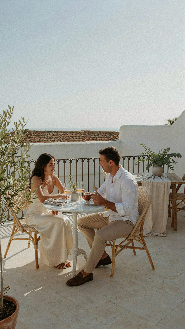 Two people talk comfortably at a spacious outdoor dining area.