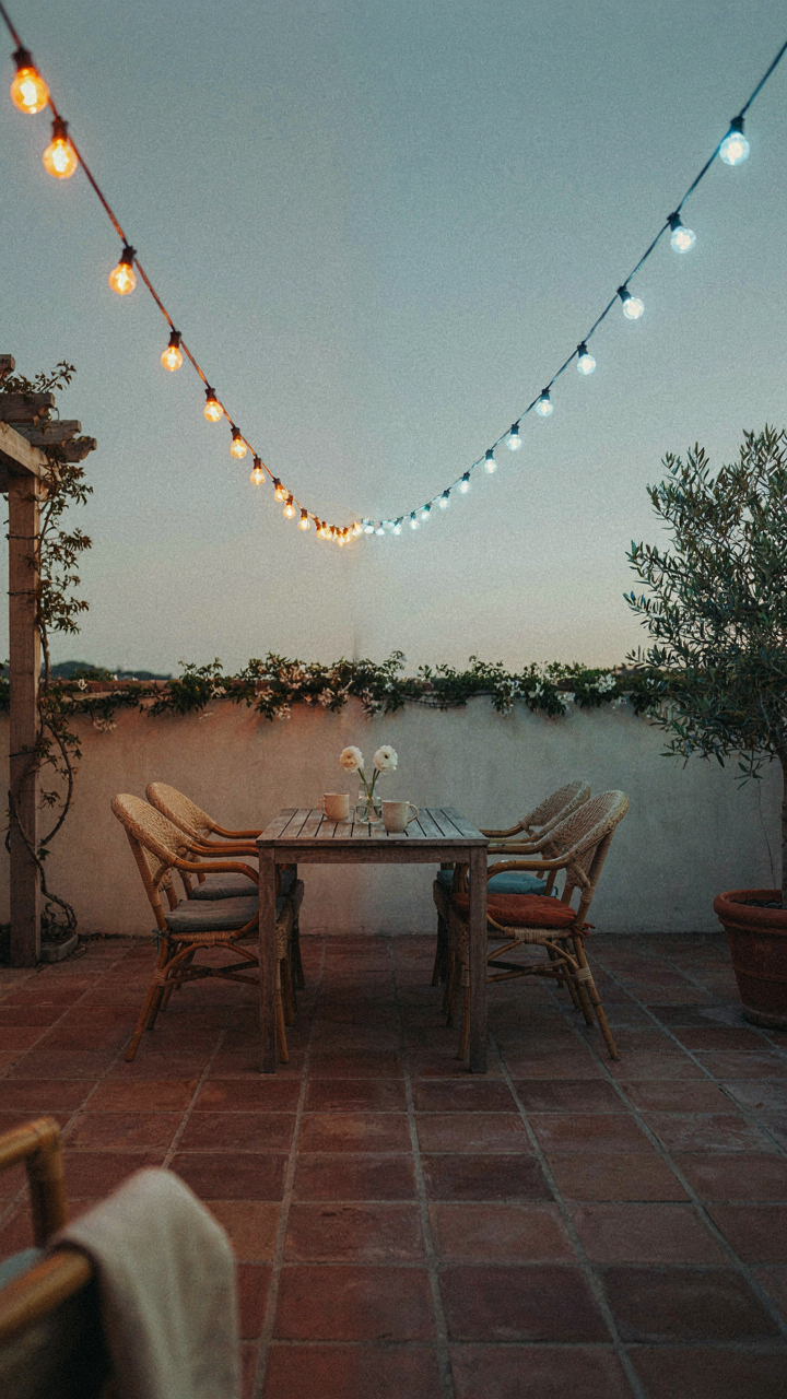 A patio with both warm orange and cool blue string lights showing color temperature.