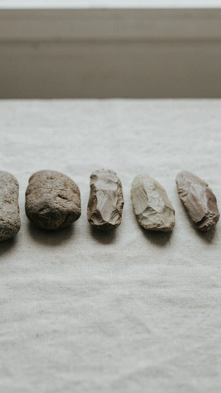 Drawings showing a tool evolving from a stone to a refined implement.