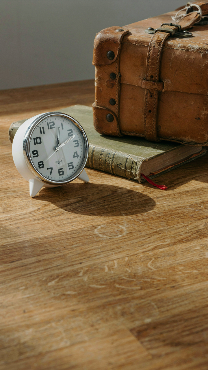 A cheap 'retro' clock next to a real vintage travel book.