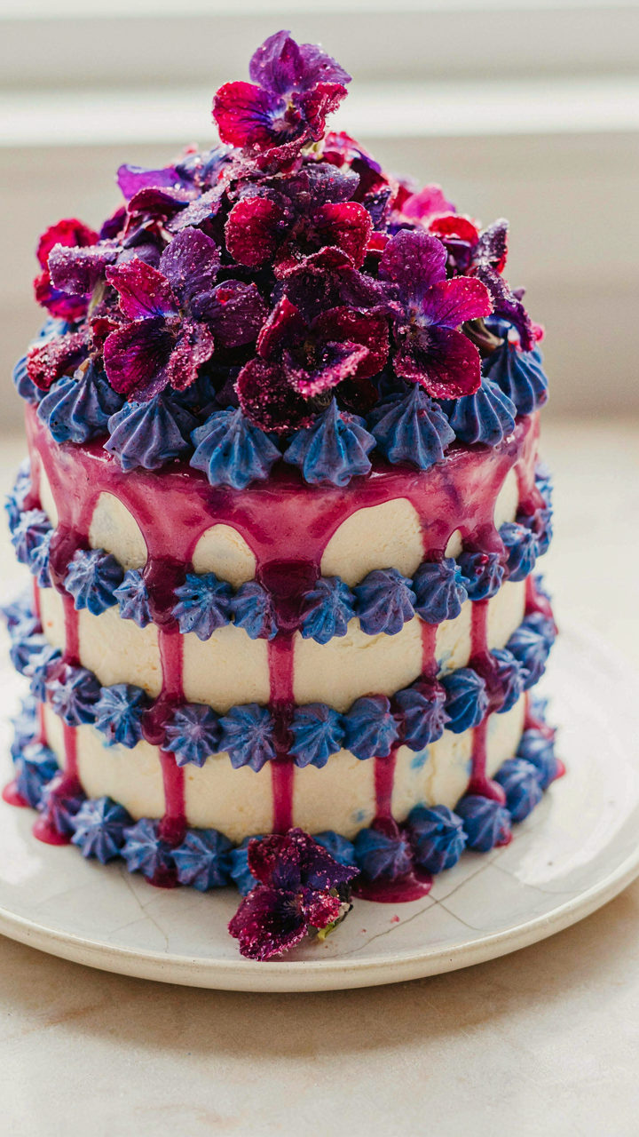 A dessert covered in many candied violets looks artificial and not tasty.