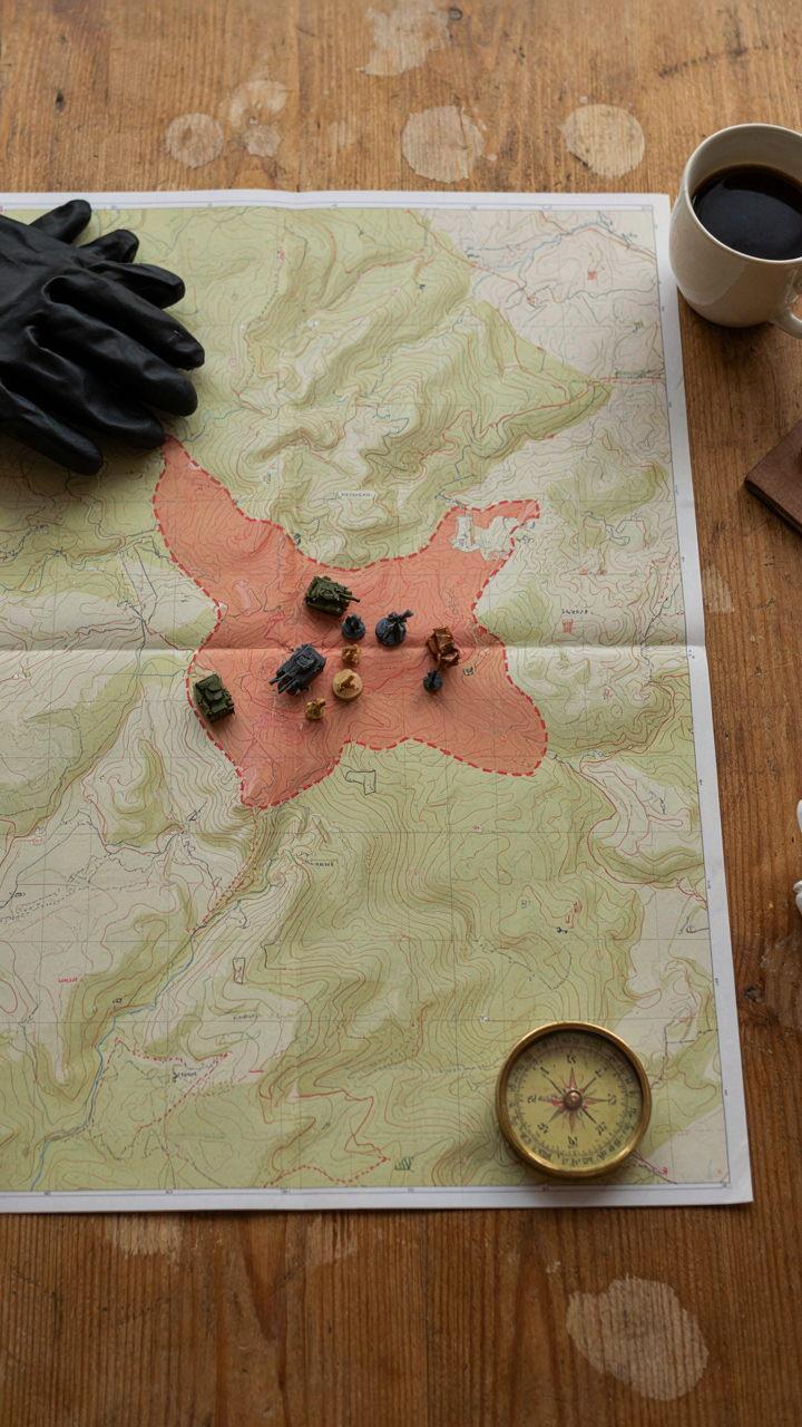 A military tactical map shows a buffer zone and perimeter.