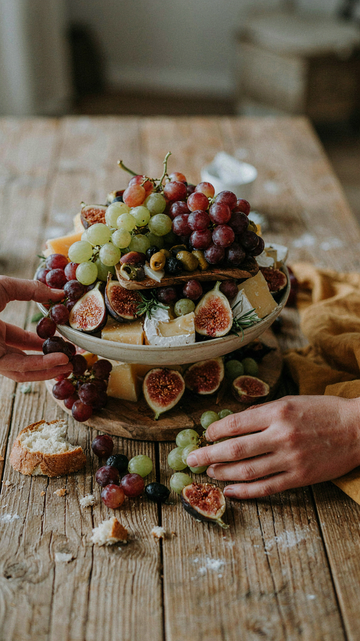 A lavish edible centerpiece overflowing with fruit and cheese.