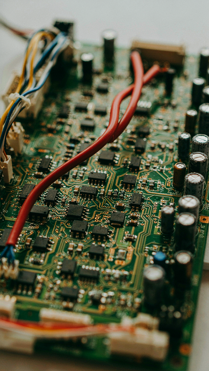 A complex electrical circuit board has one very thick wire.