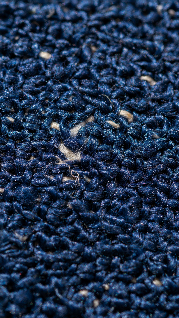 A magnified view of durable, tightly woven RV upholstery fabric fibers.