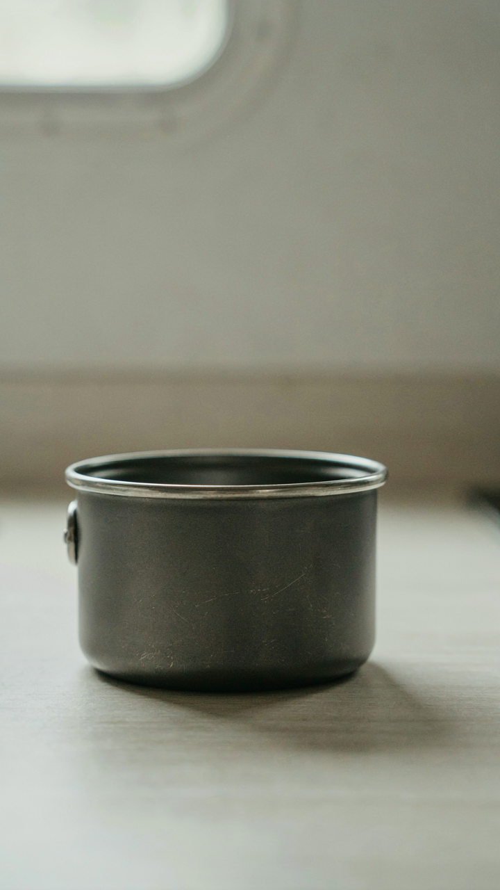 A single multi-purpose pot on a clean, empty rv kitchen counter.