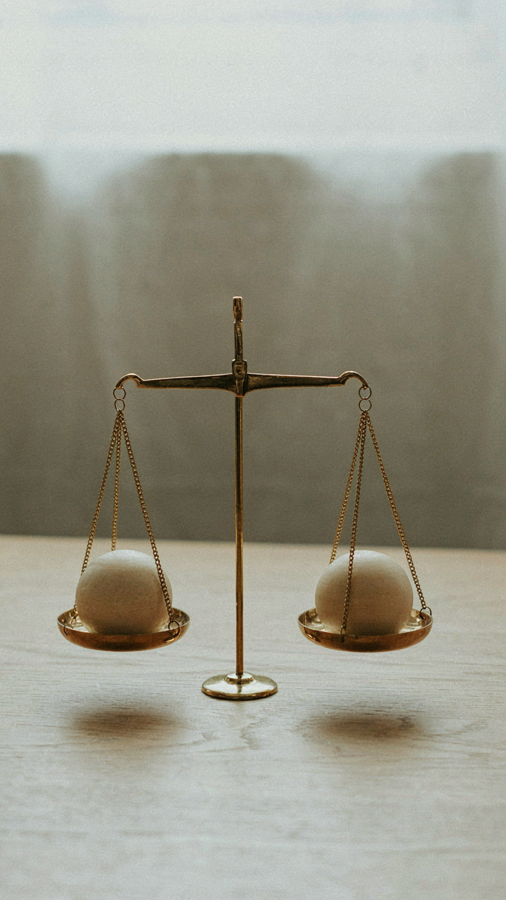 A perfectly balanced scale with equal weights on each side.