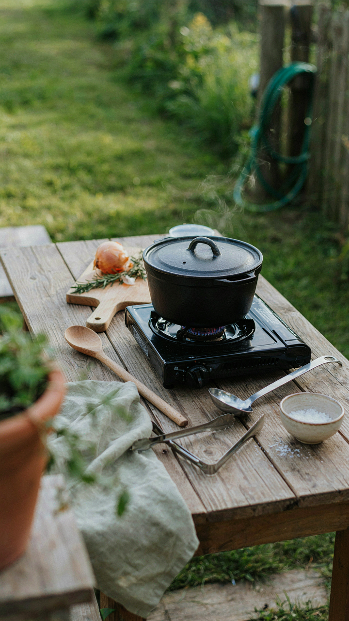 A minimalist camp kitchen with just a few tools for a backyard campout.