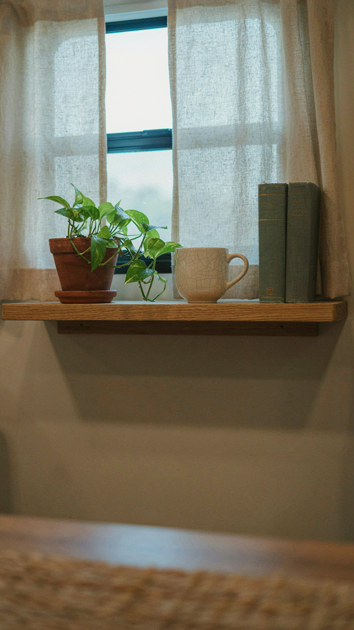A minimalist RV shelf holds a few neat items, showing uncluttered space.