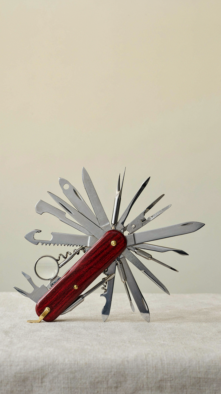 A Swiss Army knife has all its many tools open and extended.