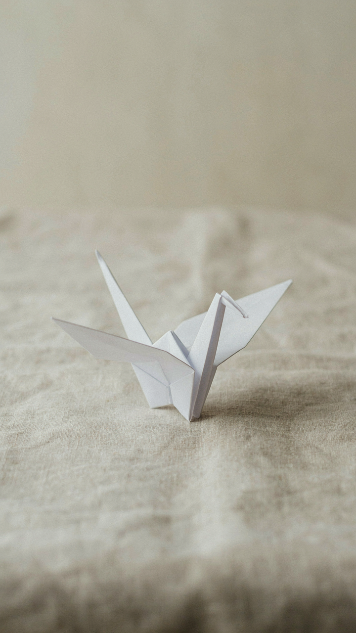 A beautiful origami crane is folded from one piece of paper.