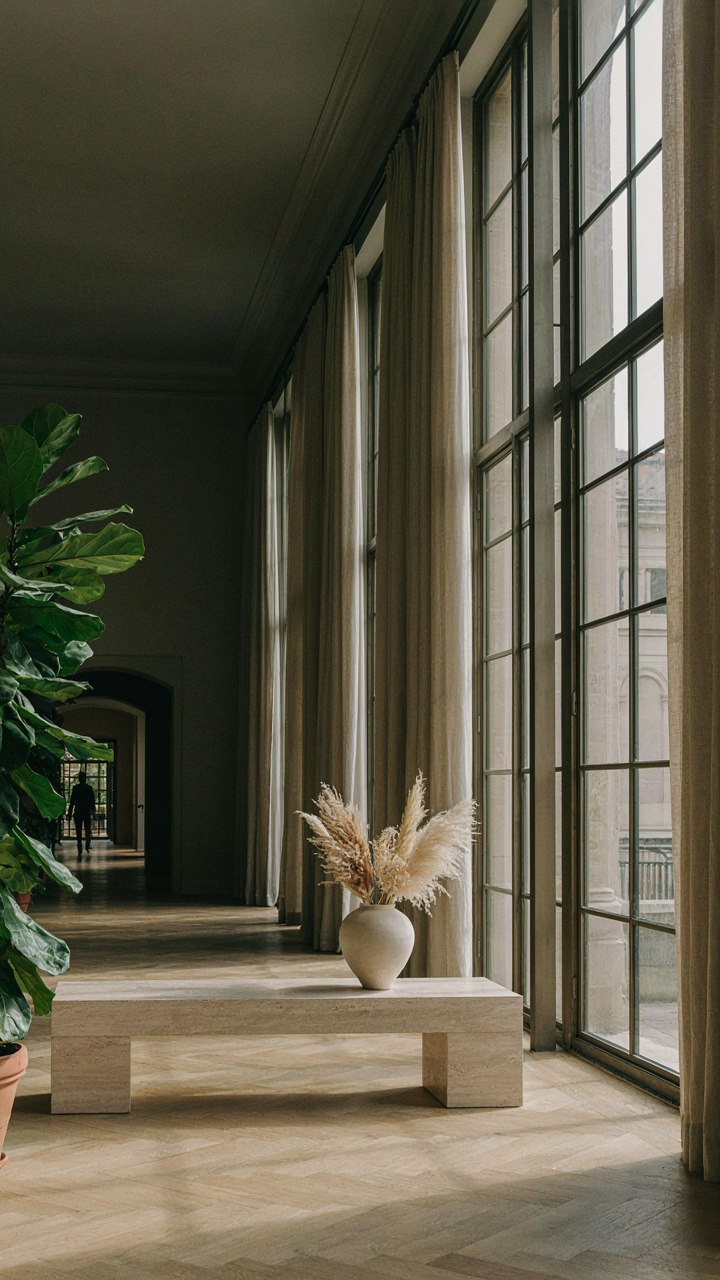 A grand room with large windows feels vast from natural light.