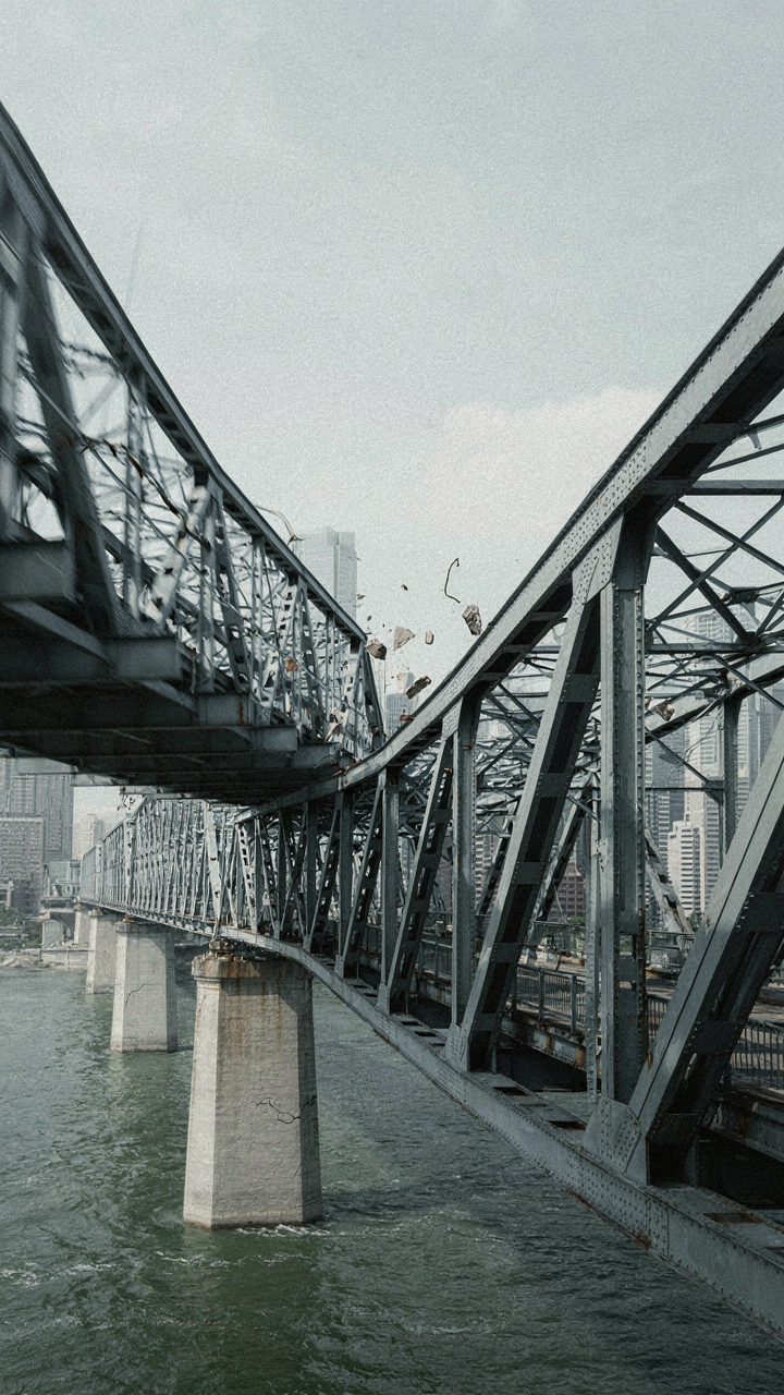 A large bridge structure sways in a simulated earthquake.