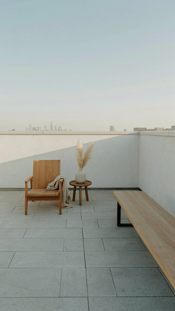 A minimalist, uncluttered cozy deck with only essential furniture.