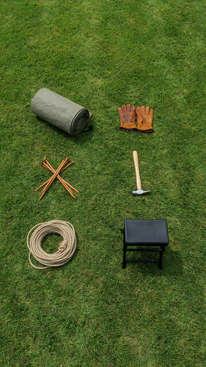 Organized tent setup steps laid out on the grass.