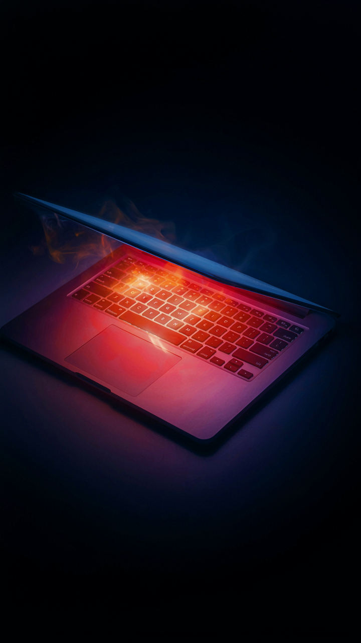 A thermal image shows heat escaping from a laptop.