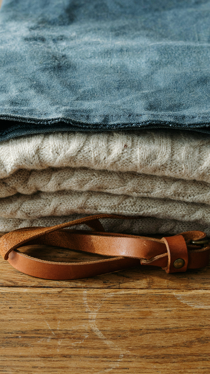 Close-up textures of durable canvas, wool, and leather, showing their natural strength.