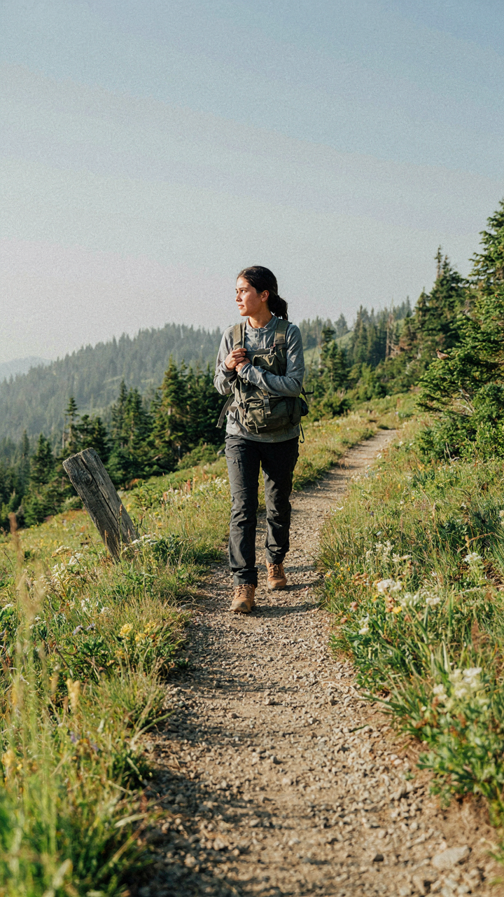 A person comfortably hiking a scenic trail, enjoying the outdoors without hardship.