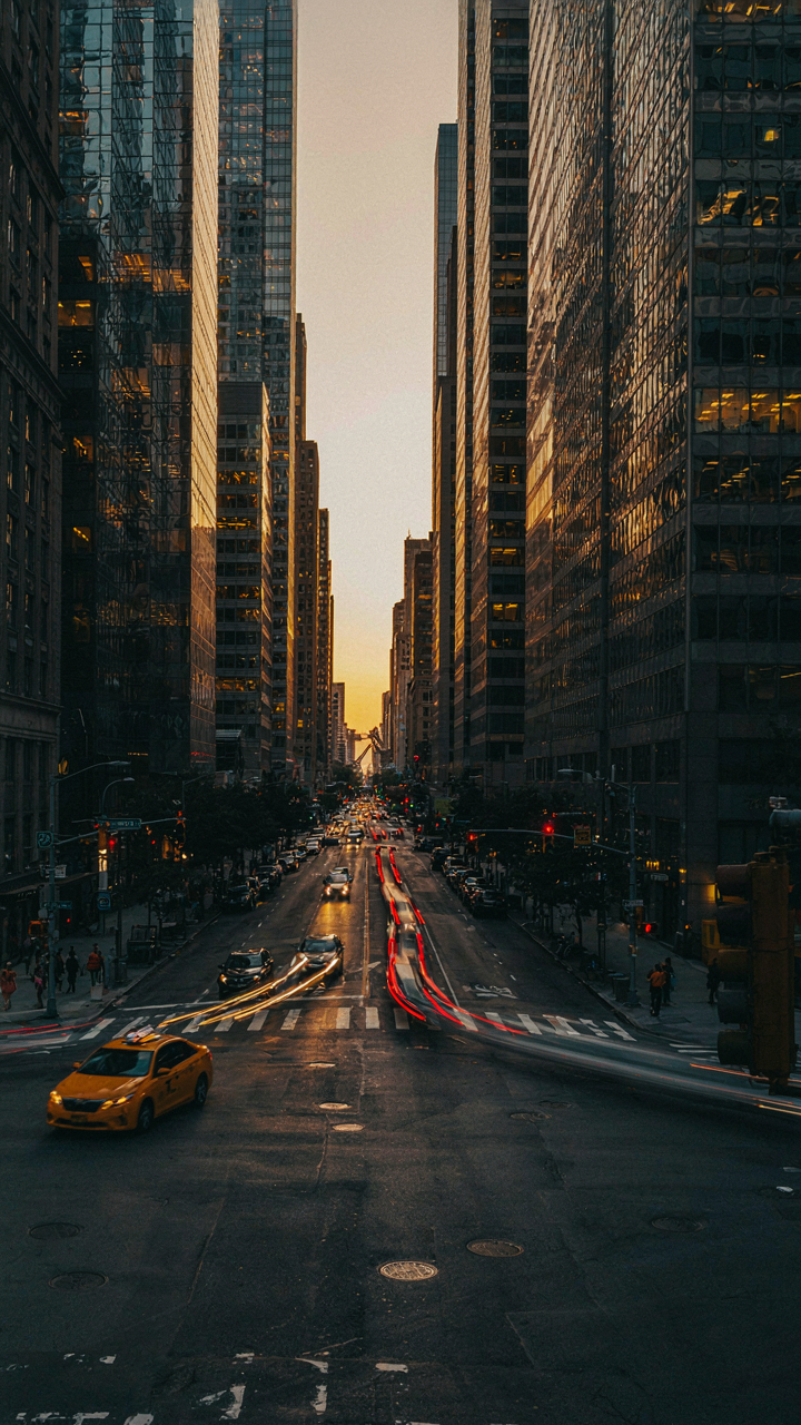 A bustling city intersection with skyscrapers, showing prime real estate.