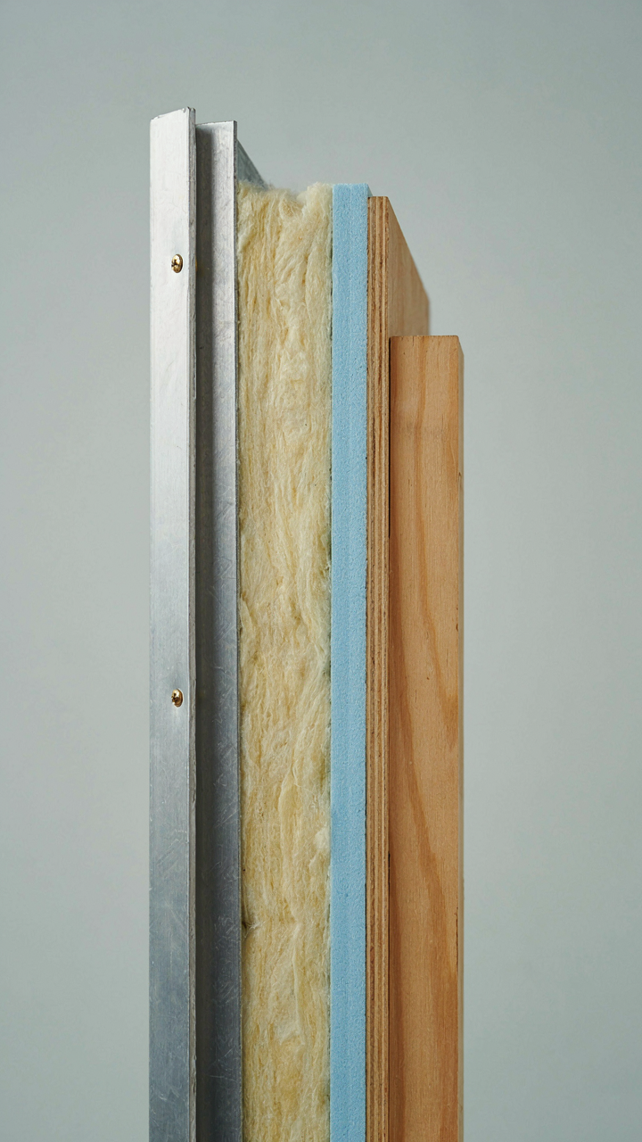 A cross-section of an RV wall with a thick, insulating curtain for thermal regulation.