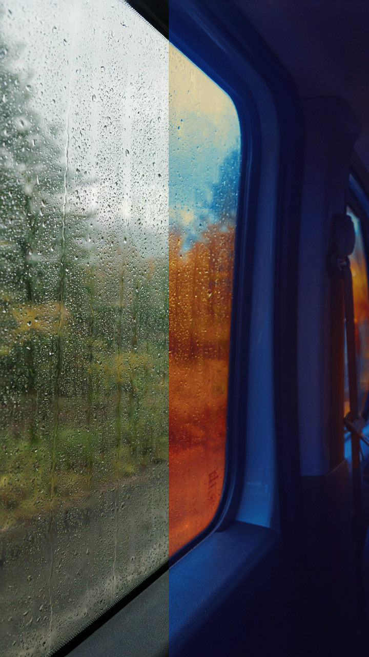Condensation forms inside a cold van window.
